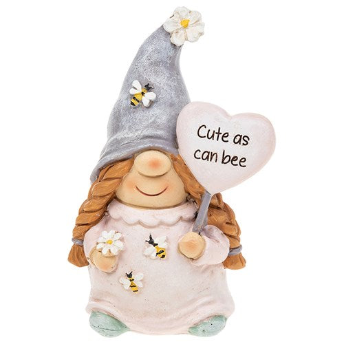 Small female gonk figure holding a flower with bees on her outfit