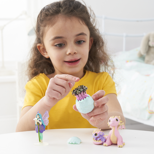 Girl playing with dragon and friends