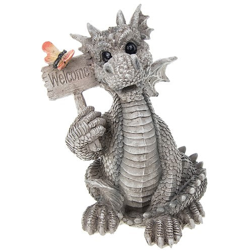 Grey dragon figure, holding a welcome sign with a butterfly sitting on top