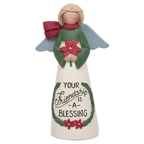 Little friendship Angel figurine. IWith a red scarf, silver wings and grren and cream dress. Holding a red flower