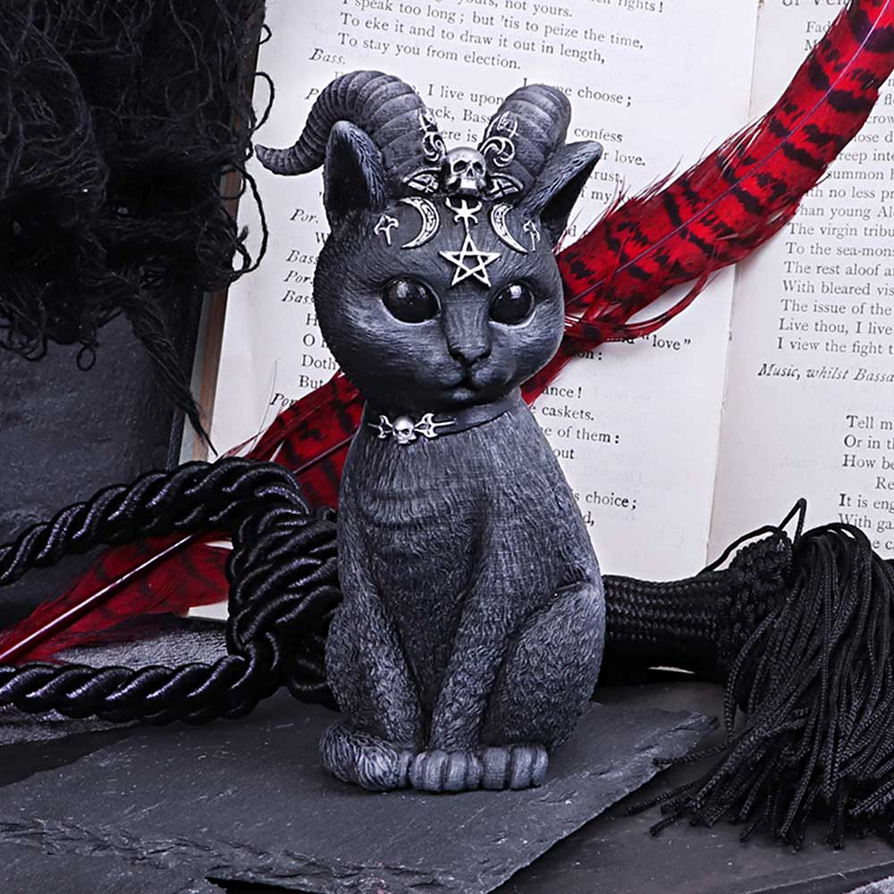 Black cat with horns and gothic details. With a book and quil behind
