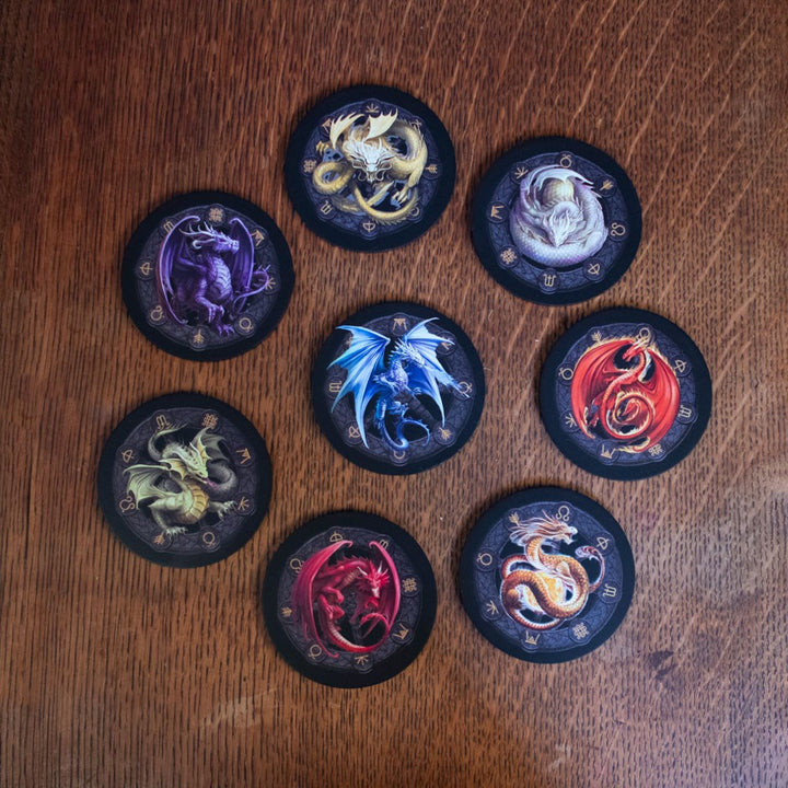 Dragons of the sabbats coasters on a table