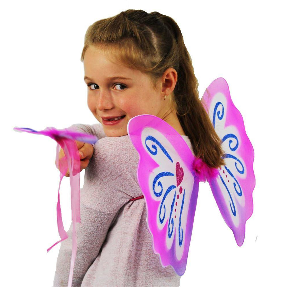 Girl demonstrating pink pixie wings and wand